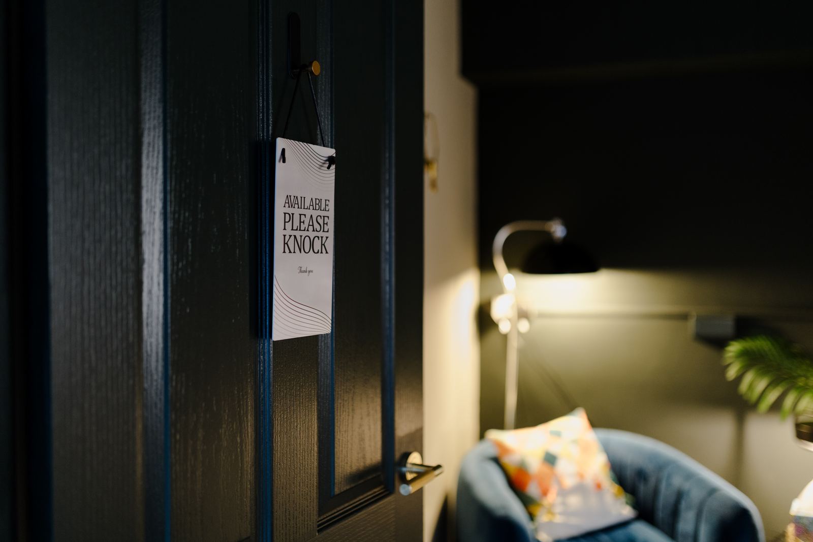 A counselling room door with an “Available, please knock” sign, at Appreciating You Counselling